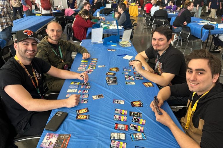 convention picture of 4 people playing Magician's Challenge